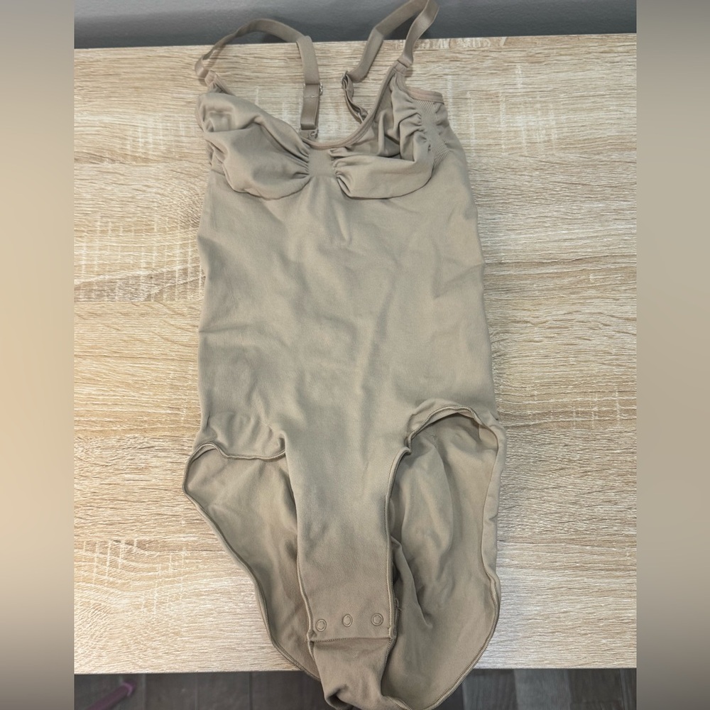 SKIMS Sculpting Seamless Bodysuit in Taupe